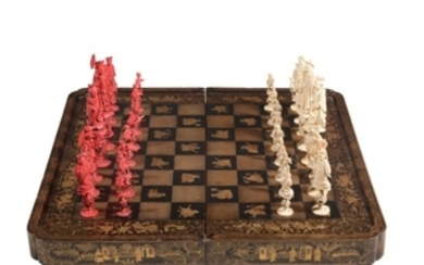 A Chinese export lacquer hinged games board and ivory chess set