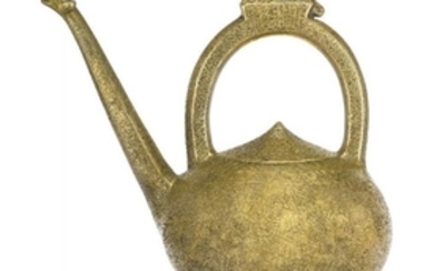 A Mughal brass ewer, engraved with Persian...
