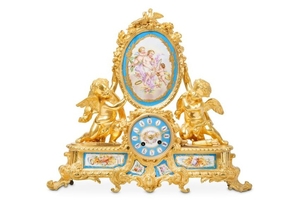 A 19TH CENTURY FRENCH GILT BRONZE AND PORCELAIN MOUNTED