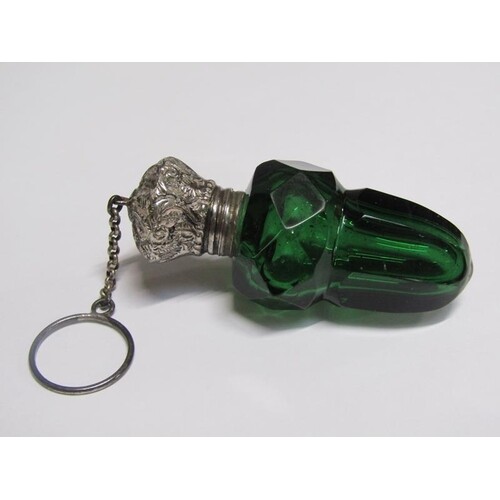 A 19c green glass scent bottle cut in the form of an acorn w...