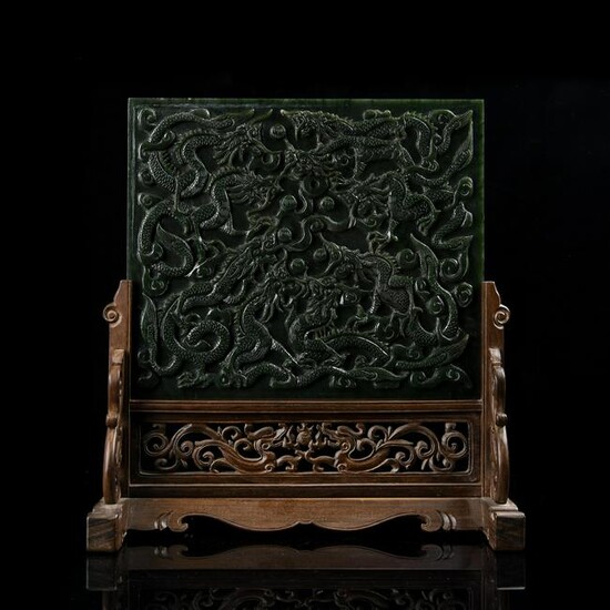 A CARVED SPINACH-GREEN JADE 'DRAGON' TABLE SCREEN.QING