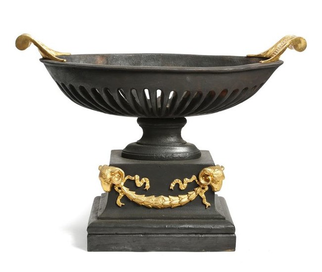 A CAST IRON AND GILT BRONZE MOUNTED BASKET...