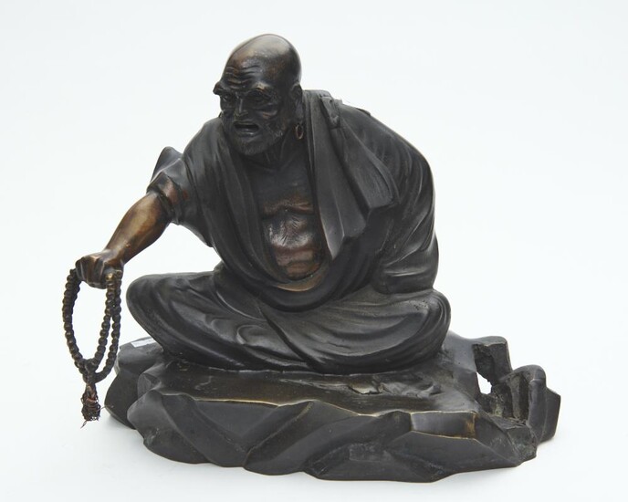 A CHINESE BRONZE FIGURE OF A SEATED SAGE HOLDING A BEADED NECKLACE, 32 CM HIGH