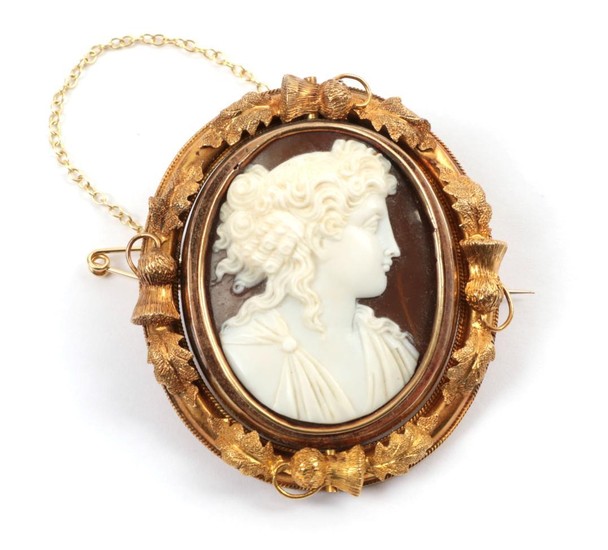 A Cameo Brooch, the classical figure within a frame with...