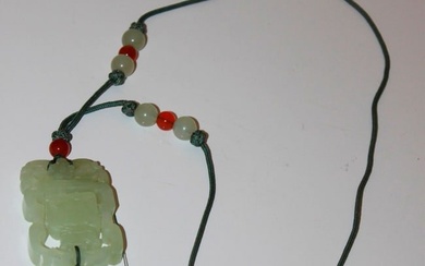 A Chinese Jade / Hardstone Movable Pendant