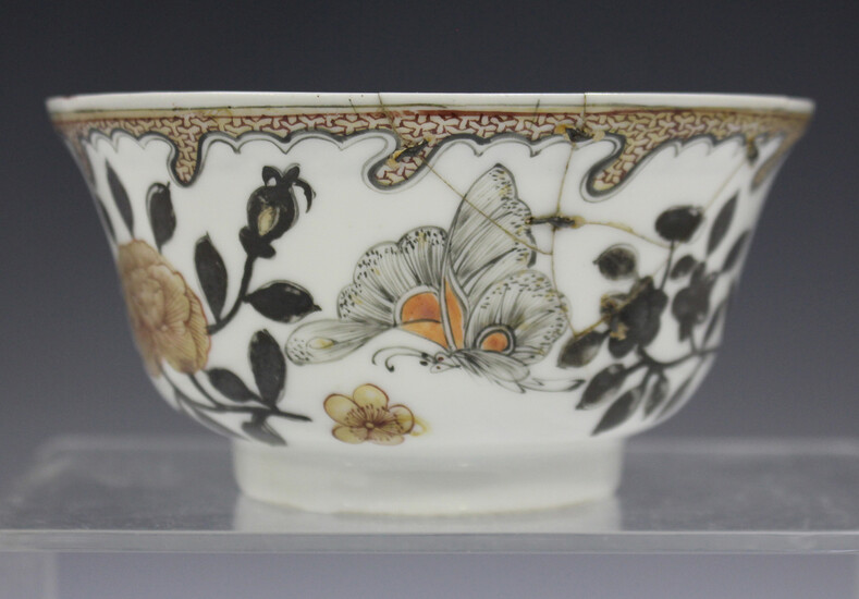 A Chinese porcelain bowl, Yongzheng period, painted en grisaille with butterflies and insects amidst