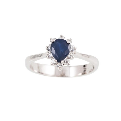 A DIAMOND AND SAPPHIRE CLUSTER RING, the pear shaped to a br...