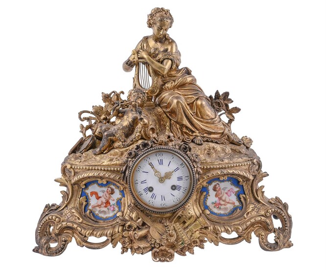 A French giltmetal and Sevres-style porcelain inset mantel clock
