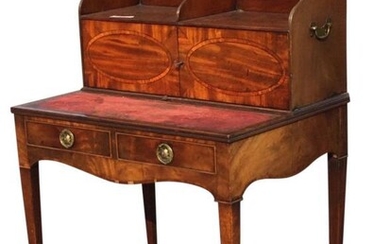 A Georgian mahogany writing desk, the top with twin...