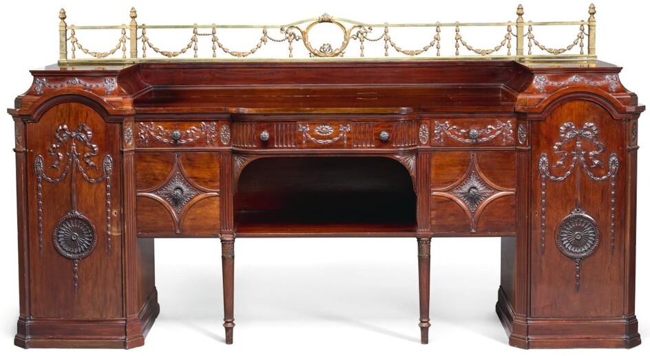 A LARGE EDWARDIAN CARVED MAHOGANY SIDEBOARD BY WARING AND GILLOW, EARLY 20TH CENTURY, IN THE MANNER OF ROBERT ADAM