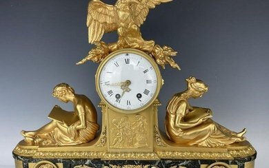 A LARGE EMPIRE STYLE DORE BRONZE AND MARBLE CLOCK
