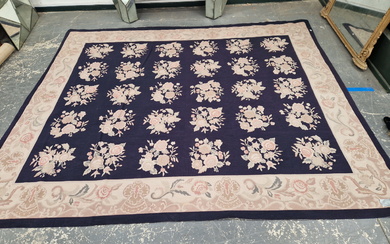 A LARGE NEEDLEPOINT CARPET OF FRENCH DESIGN.