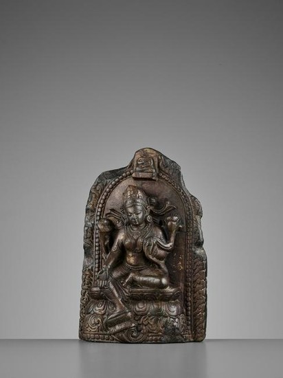 A LIMESTONE STELE OF TARA, NEPAL, 15/16TH CENTURY