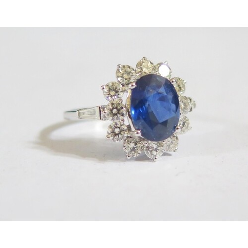 A Modern 18ct White Gold, Sapphire and Emerald Ring, sapphir...