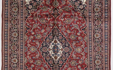A Persian Vintage Royal Kashan Rug (300x205 cm). A classic traditional Persian rug.Intricately hand knotted using lambswool in the city of Kashan in central Persia. Having an elongated Shah Abbas central medallion on ...