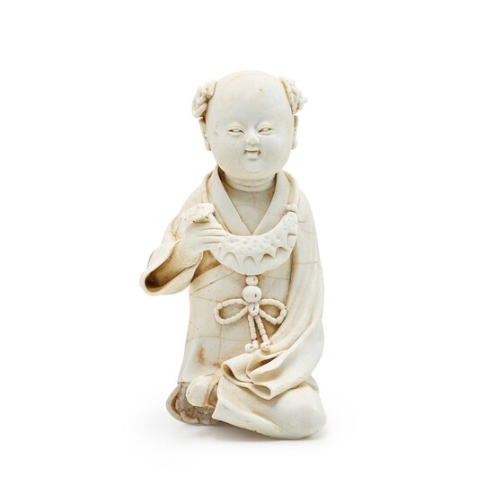 A Qingbai figure of a boy, Song dynasty 宋 青白素胎童子持芝坐像