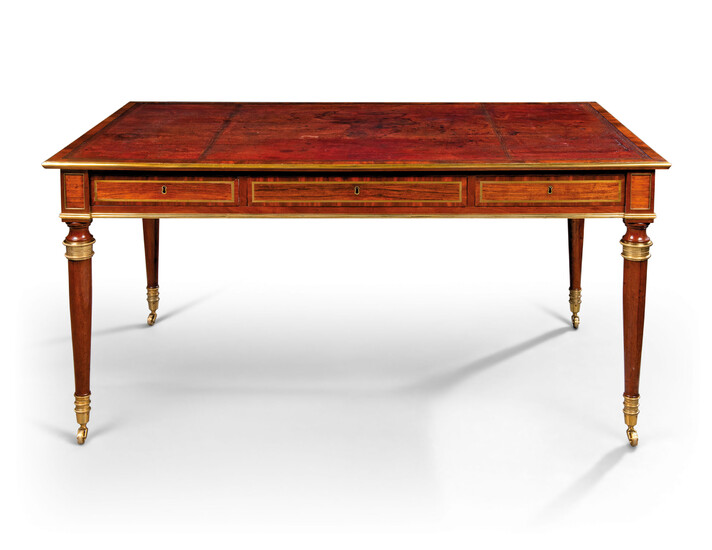 A REGENCY BRASS-MOUNTED AND BRASS-INLAID INDIAN ROSEWOOD AND MAHOGANY WRITING-TABLE
