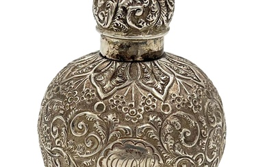 A SILVER LID PERFUME BOTTLE WITH EMBOSSED DECORATION TO...