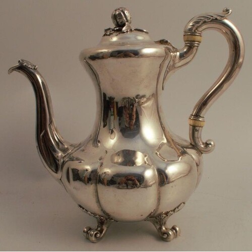 A Victorian silver coffee pot, of baluster form with shaped ...