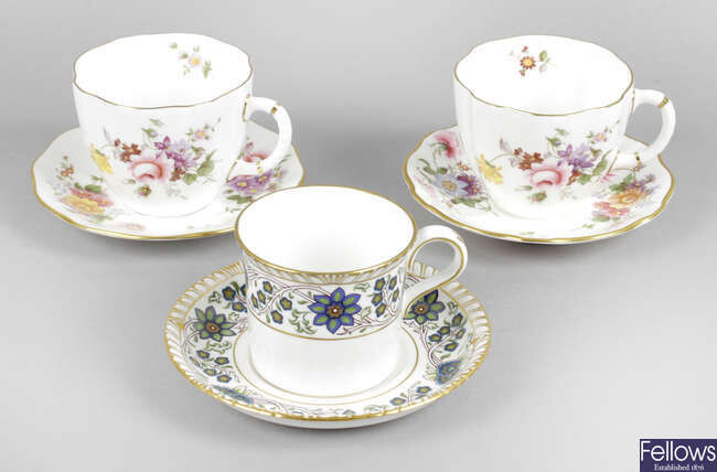 A collection of Royal Crown Derby tea wares, together with a small selection of Royal Crown Derby coffee cans and saucers.