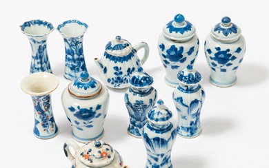 A collection of small Chinese blue and white and Imari porcelain vases, jars and teapots...