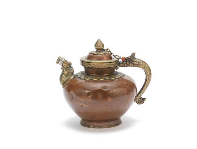 A copper alloy ewer and cover with silver-inlaid brass mounts