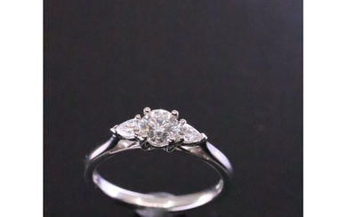 A diamond solitaire ring set with diamond shoulders, with a ...