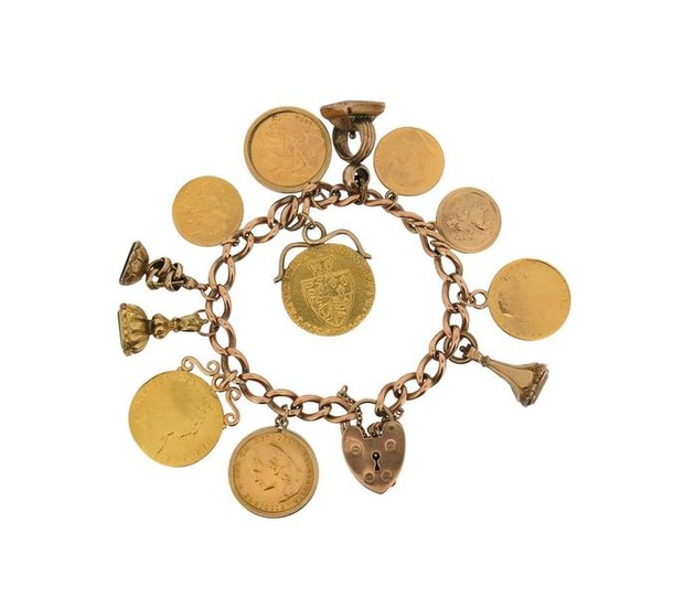 A gold charm bracelet, the 9ct gold curb...