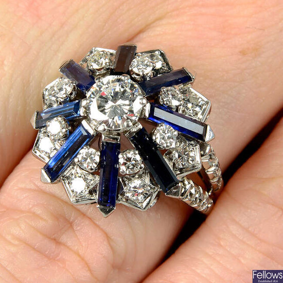 A mid 20th century 18ct gold brilliant-cut diamond and rectangular-shape sapphire cocktail ring, with single-cut diamond shoulders.