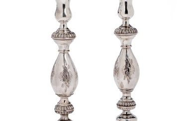 A pair of German silver candlesticks. Indistinct marks. 19th century second half....