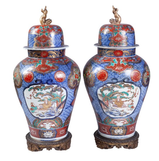 A pair of Japanese Imari porcelain vases and covers,...