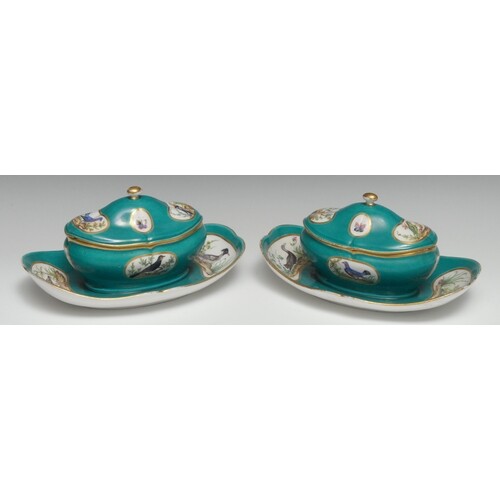 A pair of Sèvres ornithological sugar bowls and covers on fi...