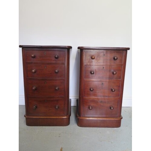 A pair of Victorian mahogany bedside cupboards with faux dra...