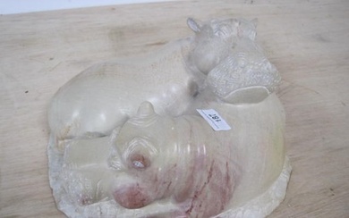 A pair of interlocked Hippos carved in soapstone. Please not...