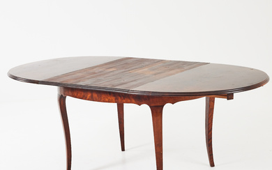 A rococo style dining table, first half of the 20th century, dressed birch.