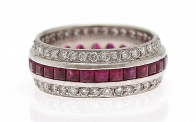 NOT SOLD. A ruby and diamond ring set with numerous square-cut rubies and brilliant-cut diamonds,...