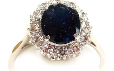 A sapphire and diamond ring, the oval cut sapphire...