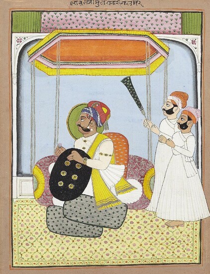 A seated ruler and attendants, Mewar, Punjab, India, circa 1900, opaque pigments heightened with gold and silver on paper, the ruler shown haloed and facing left, kneeling against a large bolster cushion and with a yellow carpet with lattice design...