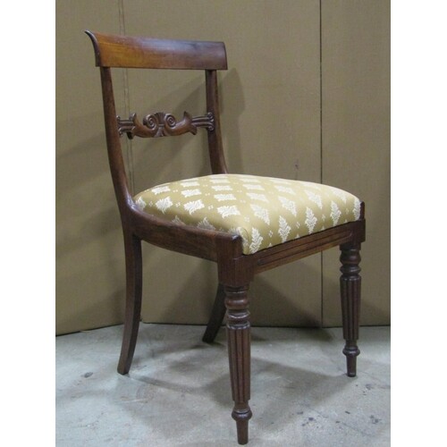 A set of four 19th century rosewood bar back dining chairs w...
