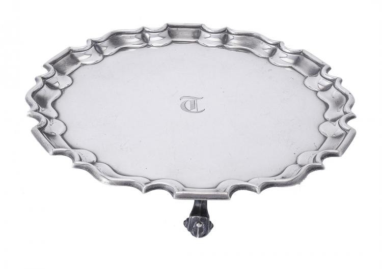 A silver shaped circular salver by Thomas Bradbury & Sons