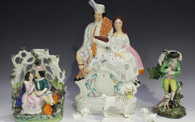A small group of Staffordshire figures, early 19th century and later, comprising a Highland couple s