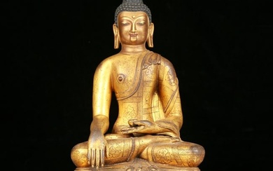 A solemn gilt bronze statue of Sakyamuni