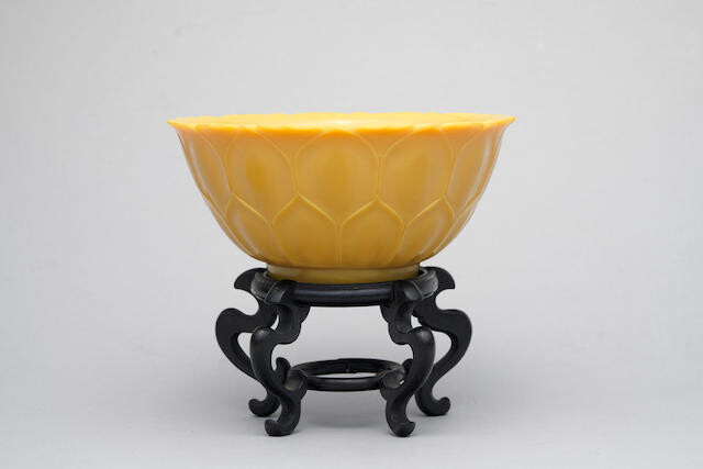 A yellow glass 'lotus' bowl