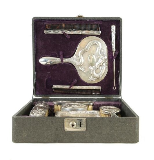 AN EARLY CHINESE EXPORT CASED SILVER DRESSING TABLE SET