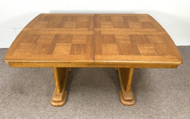 An Art Deco style extending dining table, with a single additional leaf, with 'chequered' top and
