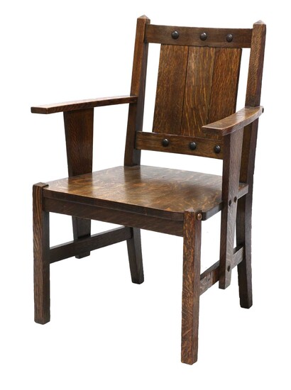 An Arts and Crafts oak elbow chair