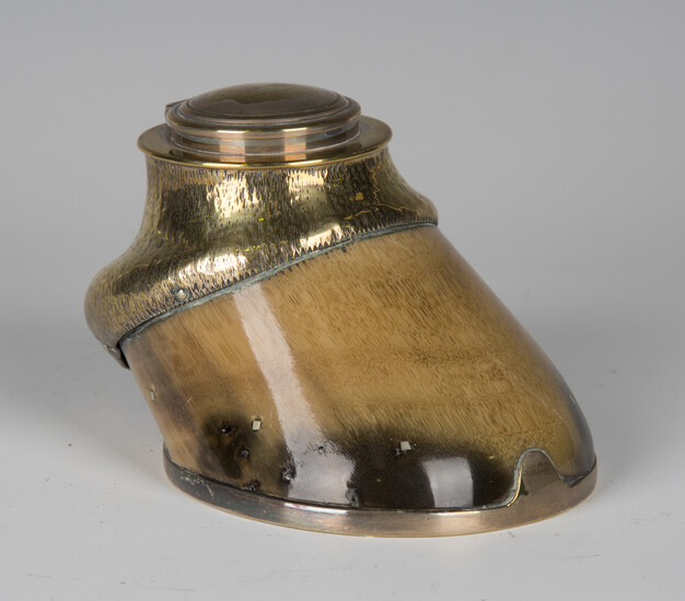 An Edwardian brass mounted horse hoof inkwell, the hinged lid detailed 'Red Lancer 1882-1902
