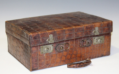An early 20th century crocodile skin case with nickel plated fittings, height 19cm, width 45cm (deta