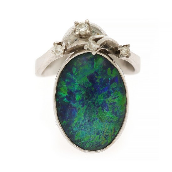 An opal and diamond ring set with an opal cabochon and four brilliant-cut diamonds, mounted in 14k white gold. Size 52.