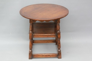 Antique Oak Reproduction Tavern Table. The table with a lowe...